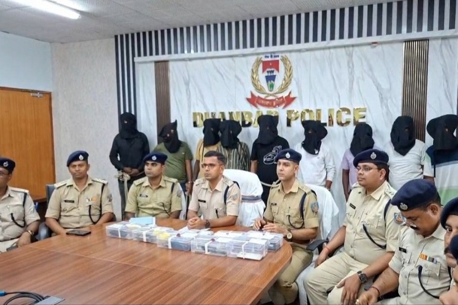 A press conference scene at Dhanbad Police headquarters